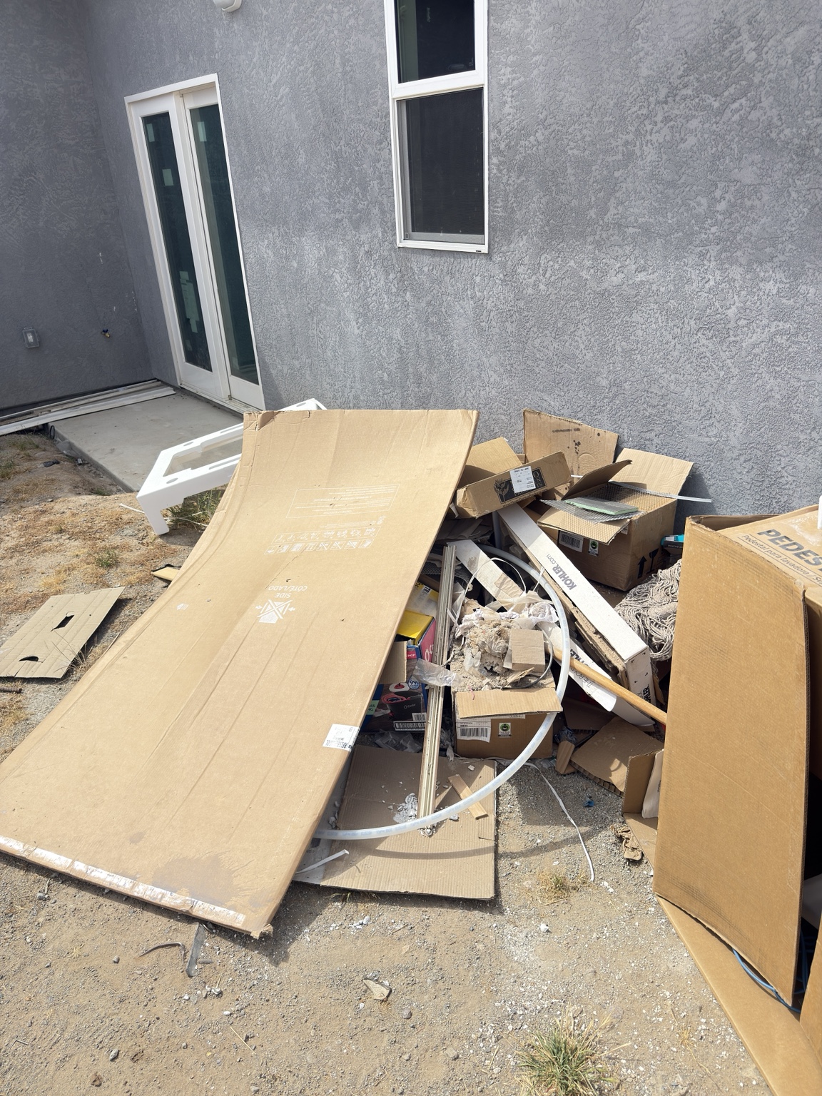 Cardboard and household debris before pickup