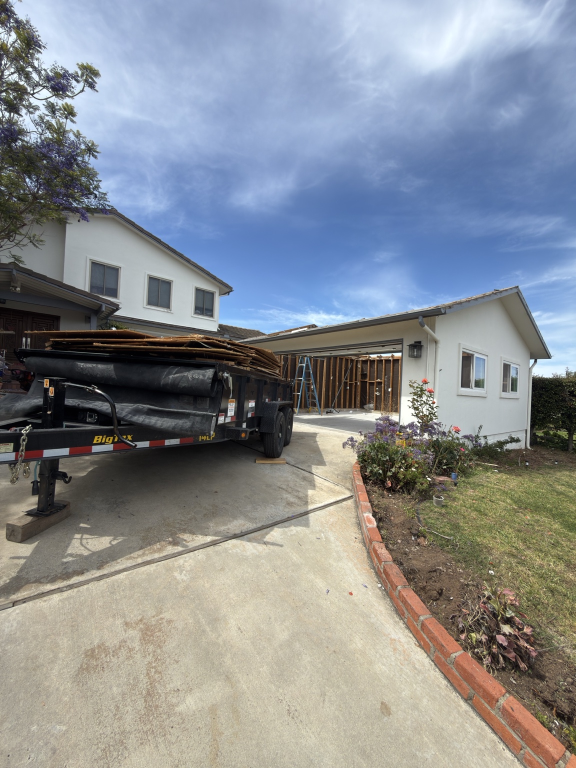 Dump trailer loaded during a residential demolition project