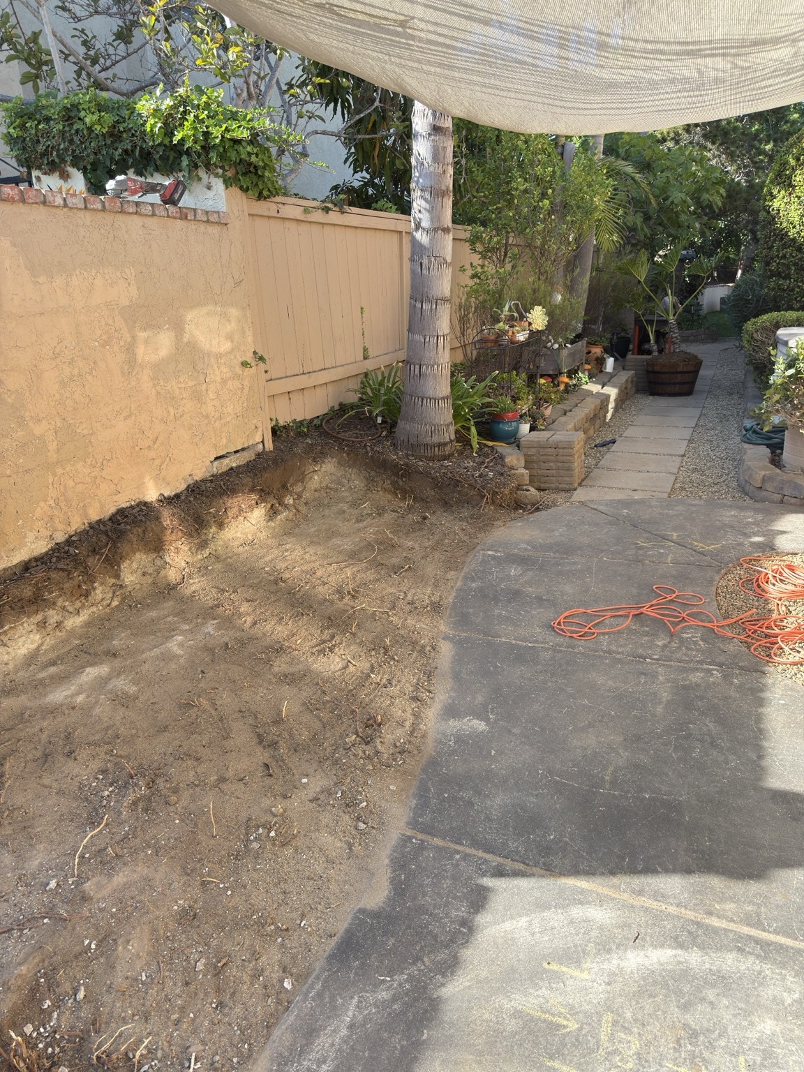 Wall removed and dirt excavation underway