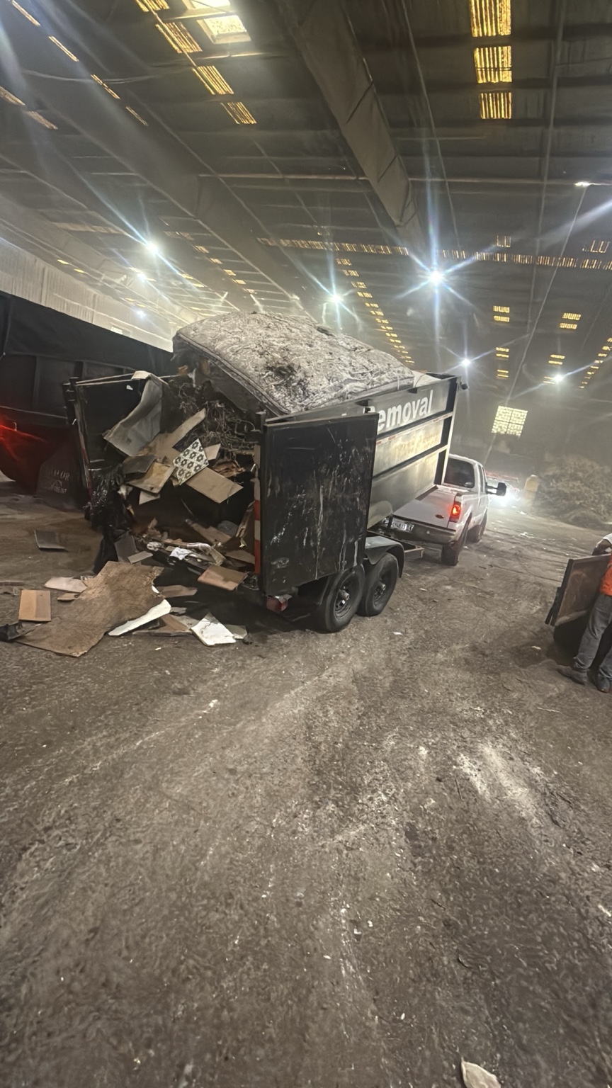 SD Pros dump trailer loaded for a junk removal job